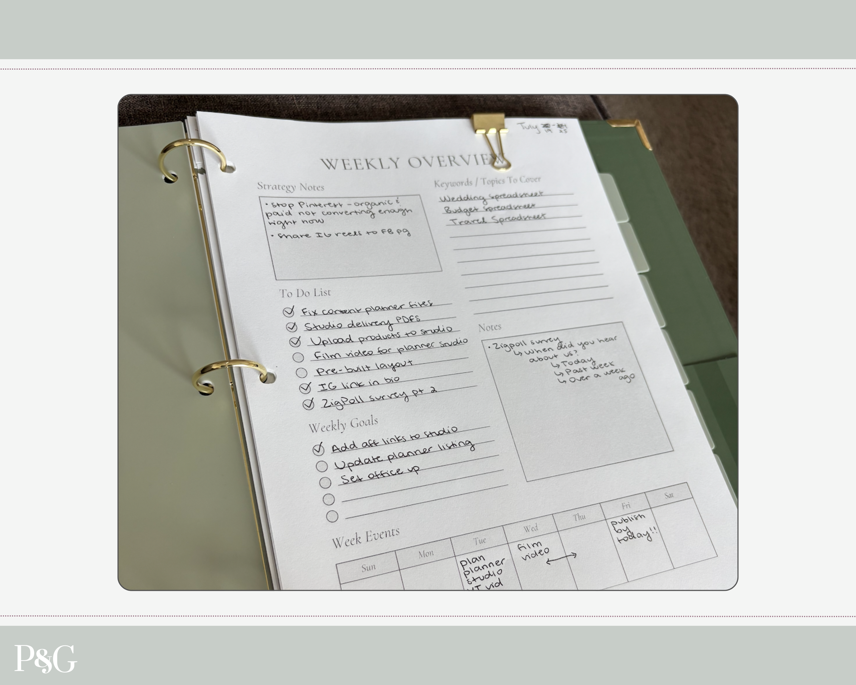 A weekly overview planner insert page from a three-ring binder, shown open on a dark surface. The page includes labeled sections for strategy notes, to-do list, notes, weekly goals, and work events, with handwritten entries.